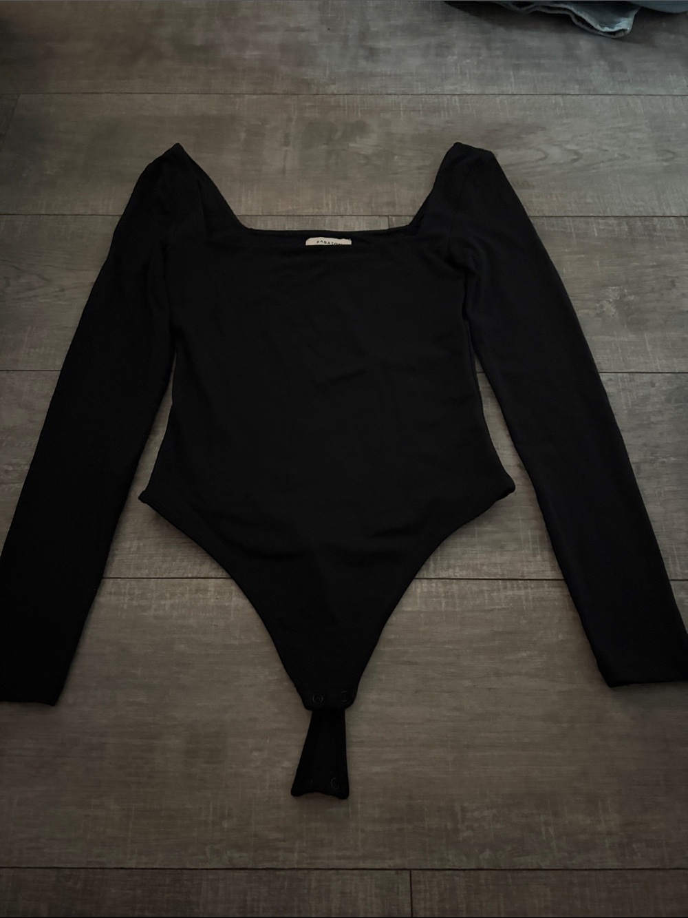 Babaton Black Long-Sleeve Square Neck One-Piece Bodysuit